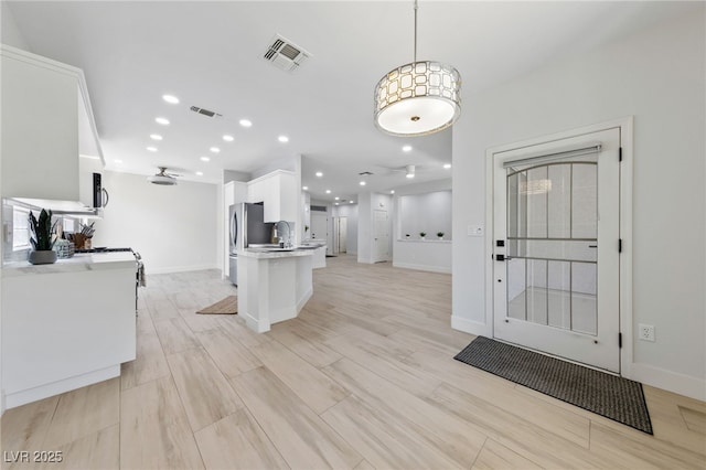 2029 Poppywood Ave, Henderson, NV 89012 - kitchen featuring white cabinets, freestanding refrigerator, recessed lighting, baseboards, and light countertops