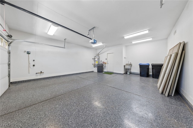 2029 Poppywood Ave, Henderson, NV 89012 - garage featuring a garage door opener and baseboards