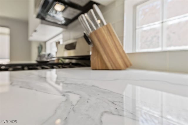 2029 Poppywood Ave, Henderson, NV 89012 - kitchen view of light stone counters and white cabinets