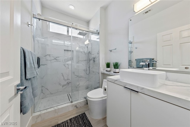 2029 Poppywood Ave, Henderson, NV 89012 - bathroom featuring toilet, a marble finish shower, and vanity