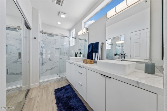 2029 Poppywood Ave, Henderson, NV 89012 - bathroom with a marble finish shower, double vanity, and recessed lighting