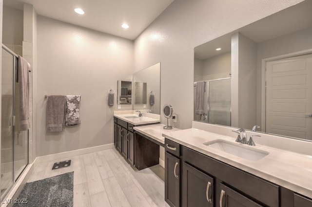 4893 E Cedar Creek Way, Pahrump, NV 89061 - full bathroom featuring a stall shower, recessed lighting, vanity, wood finished floors, and baseboards