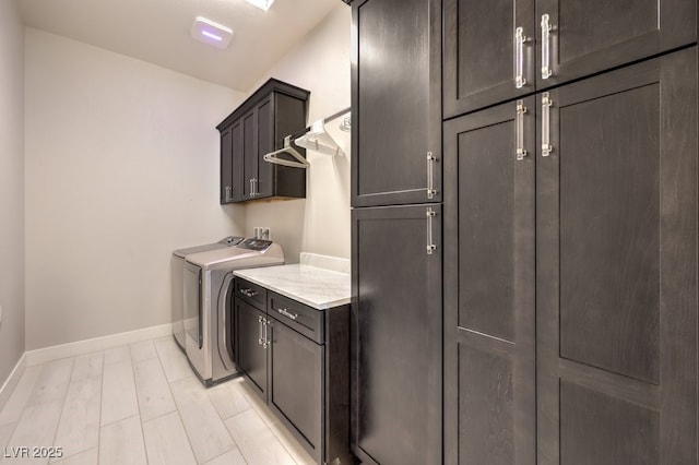 4893 E Cedar Creek Way, Pahrump, NV 89061 - laundry room featuring cabinet space, baseboards, and washer and dryer