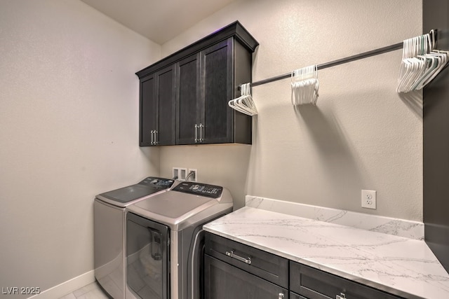 4893 E Cedar Creek Way, Pahrump, NV 89061 - laundry area featuring cabinet space, washing machine and clothes dryer, and baseboards