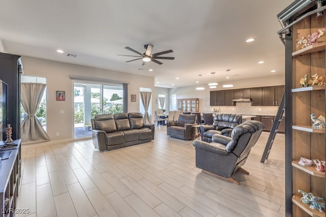 4893 E Cedar Creek Way, Pahrump, NV 89061 - living area with ceiling fan, recessed lighting, and light wood-type flooring