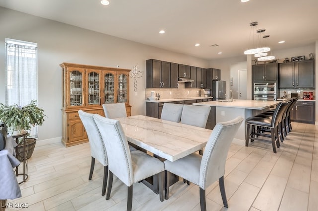 4893 E Cedar Creek Way, Pahrump, NV 89061 - dining room with recessed lighting, baseboards, and light wood-style floors