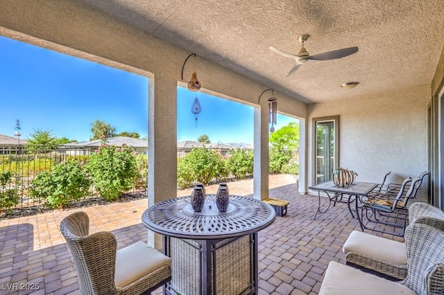 4893 E Cedar Creek Way, Pahrump, NV 89061 - view of patio with a fenced backyard, ceiling fan, and outdoor dining space