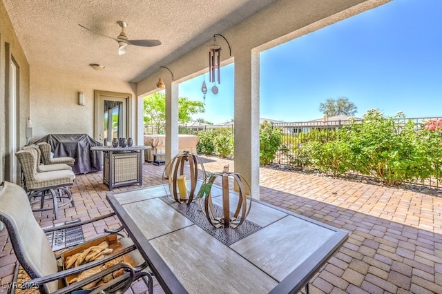 4893 E Cedar Creek Way, Pahrump, NV 89061 - view of patio / terrace with outdoor dining area, a ceiling fan, and a fenced backyard