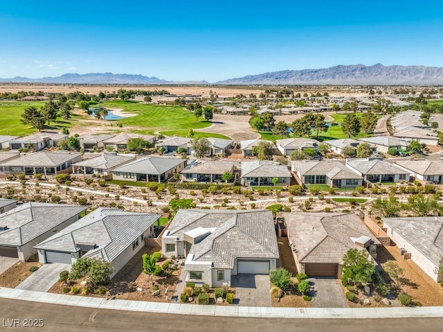 4893 E Cedar Creek Way, Pahrump, NV 89061 - aerial perspective of suburban area featuring a golf course and a water and mountain view