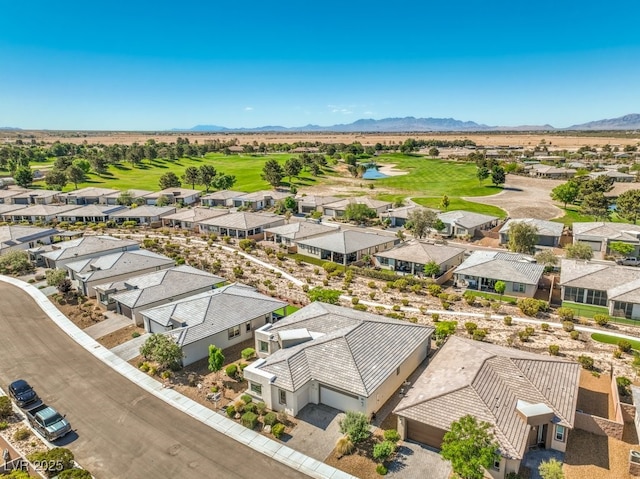 4893 E Cedar Creek Way, Pahrump, NV 89061 - aerial perspective of suburban area featuring a golf club and a water and mountain view