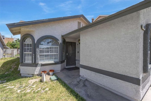 1622 Lorna Dr, Henderson, NV 89011 - entrance to property with stucco siding and fence