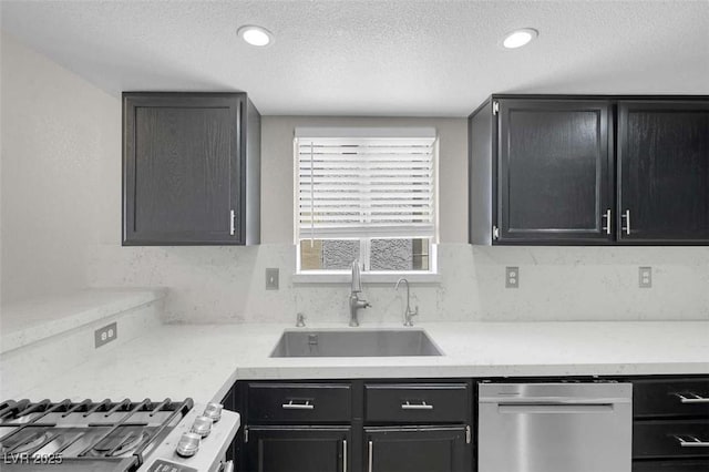 1622 Lorna Dr, Henderson, NV 89011 - kitchen with dishwasher, a sink, stove, a textured ceiling, and recessed lighting
