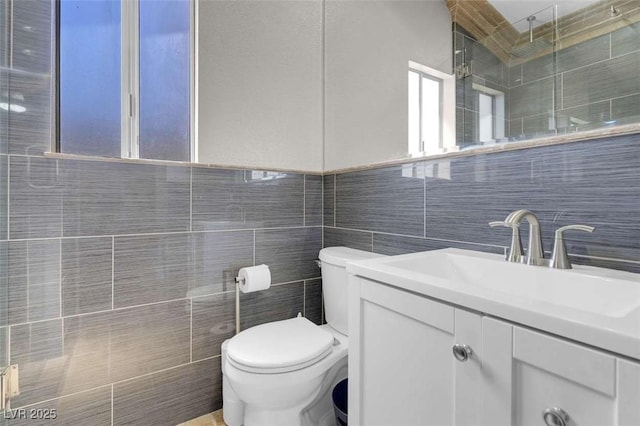 1622 Lorna Dr, Henderson, NV 89011 - bathroom with tile walls, toilet, vanity, and tiled shower