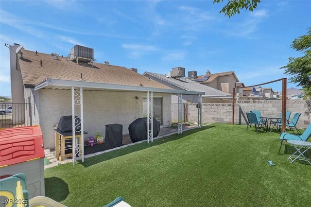 1622 Lorna Dr, Henderson, NV 89011 - back of property with a shingled roof, central air condition unit, and stucco siding