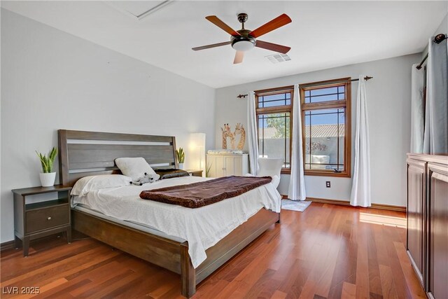 10520 Maystar Ln, Las Vegas, NV 89135 - bedroom featuring wood finished floors, baseboards, and ceiling fan