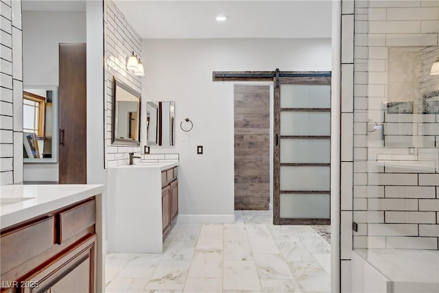10520 Maystar Ln, Las Vegas, NV 89135 - bathroom with marble finish flooring, two vanities, recessed lighting, and baseboards