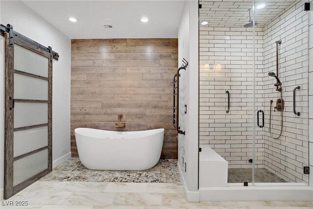 10520 Maystar Ln, Las Vegas, NV 89135 - bathroom with recessed lighting, a freestanding bath, a stall shower, and marble finish flooring