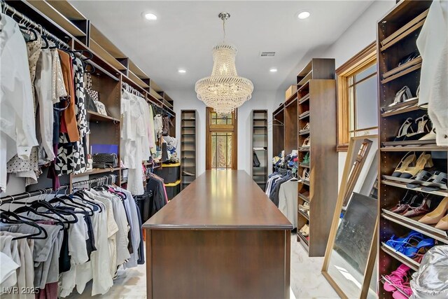 10520 Maystar Ln, Las Vegas, NV 89135 - walk in closet with a chandelier