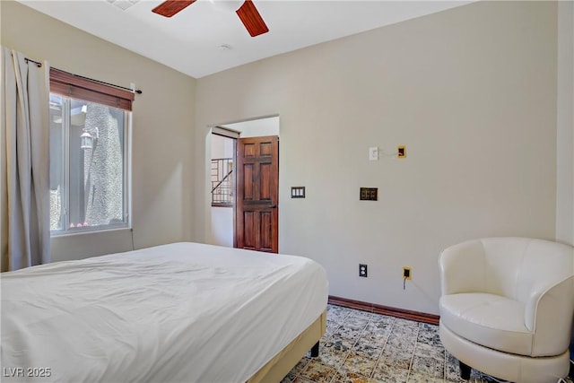 10520 Maystar Ln, Las Vegas, NV 89135 - bedroom with baseboards and a ceiling fan