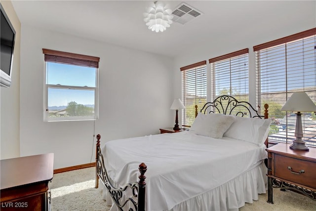 10520 Maystar Ln, Las Vegas, NV 89135 - carpeted bedroom with multiple windows and baseboards