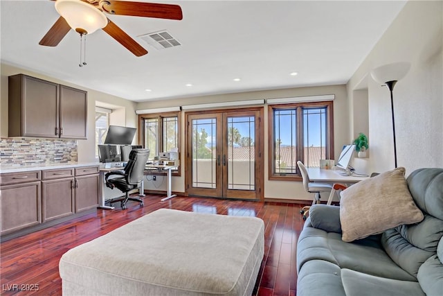 home office with plenty of natural light, french doors, dark wood finished floors, ceiling fan, and recessed lighting