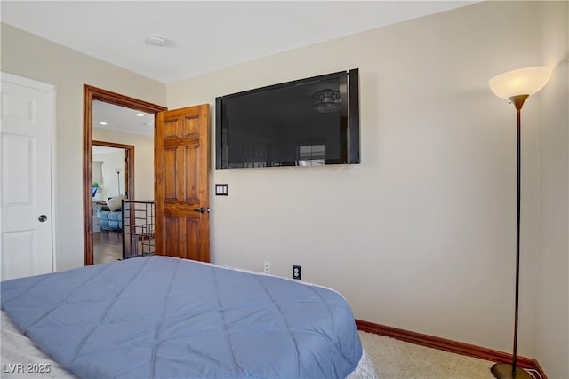 carpeted bedroom with baseboards