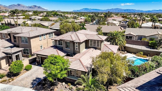 10520 Maystar Ln, Las Vegas, NV 89135 - aerial perspective of suburban area with mountains and a pool area