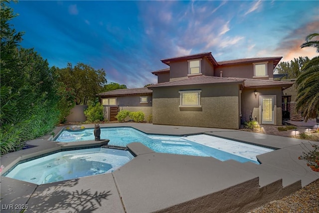 10520 Maystar Ln, Las Vegas, NV 89135 - pool at dusk with a pool with connected hot tub