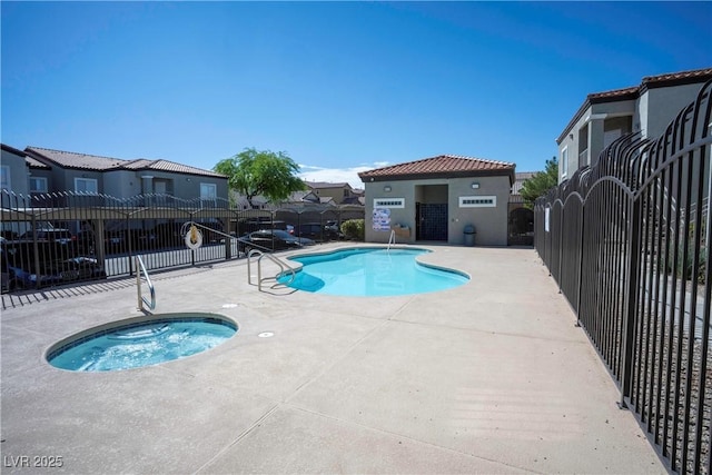 6160 Rumrill St Unit 121, Las Vegas, NV 89113 - community pool featuring fence, a hot tub, a patio, and a residential view