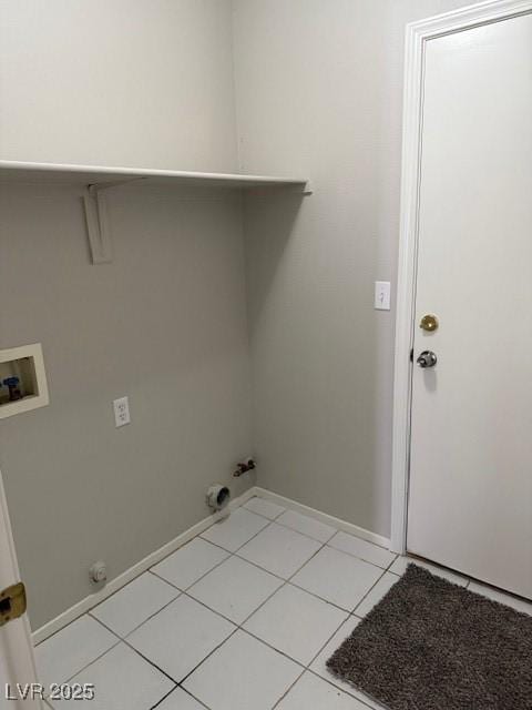 laundry area featuring hookup for a gas dryer, hookup for a washing machine, light tile patterned floors, and baseboards