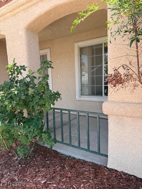 view of exterior entry with stucco siding