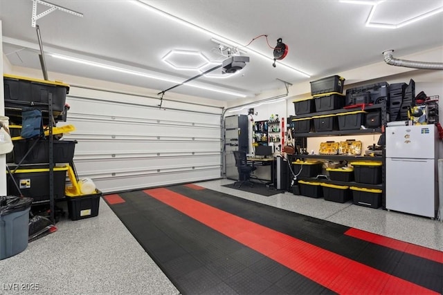 9710 Hiking Ave, Las Vegas, NV 89166 - garage with freestanding refrigerator and a garage door opener