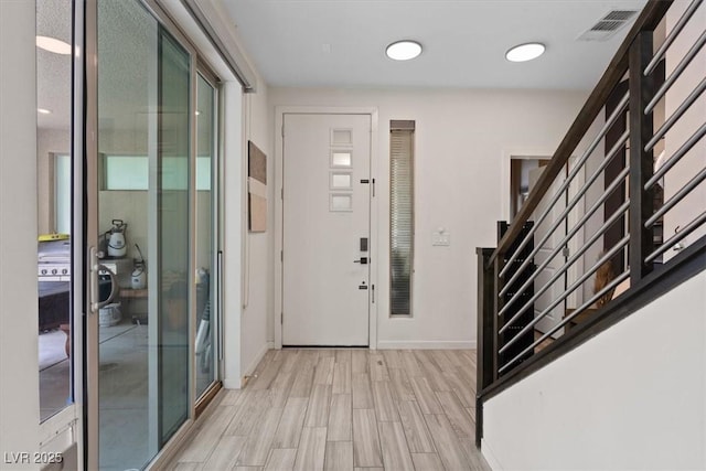 9710 Hiking Ave, Las Vegas, NV 89166 - foyer with light wood-style flooring, baseboards, and stairs