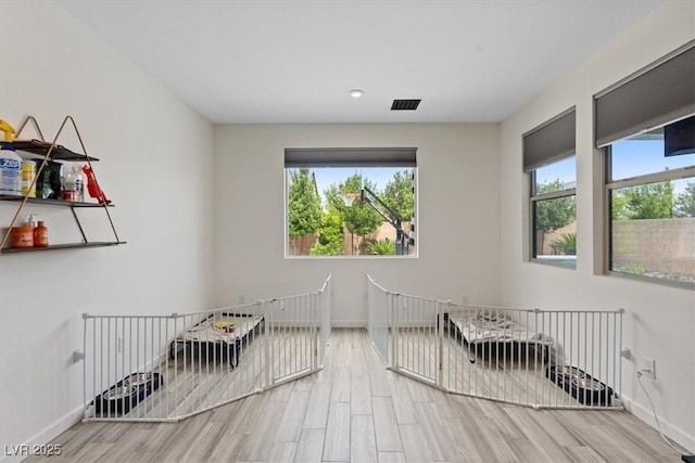 9710 Hiking Ave, Las Vegas, NV 89166 - unfurnished bedroom with a nursery area, wood finished floors, baseboards, and recessed lighting