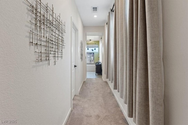9710 Hiking Ave, Las Vegas, NV 89166 - hallway featuring carpet, baseboards, and a textured wall
