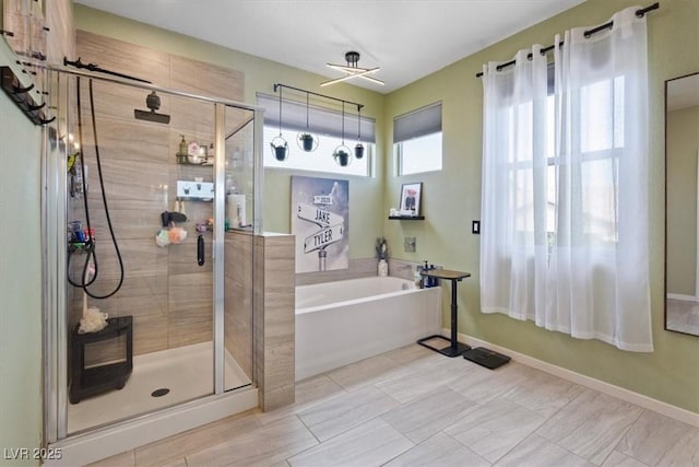 9710 Hiking Ave, Las Vegas, NV 89166 - full bath with a bath, a stall shower, and baseboards