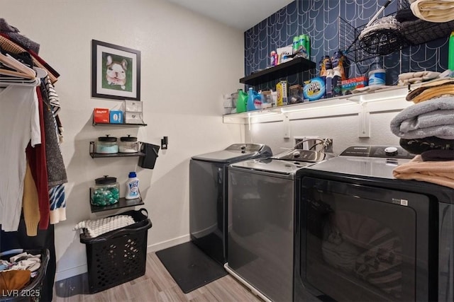 9710 Hiking Ave, Las Vegas, NV 89166 - laundry room featuring separate washer and dryer, wood finished floors, and baseboards