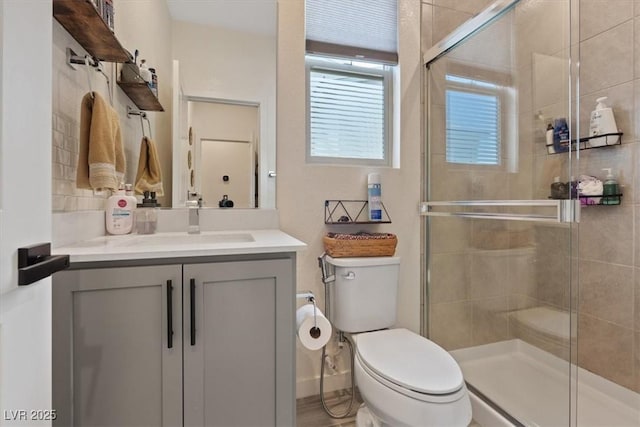 9710 Hiking Ave, Las Vegas, NV 89166 - bathroom featuring toilet, vanity, and a shower stall