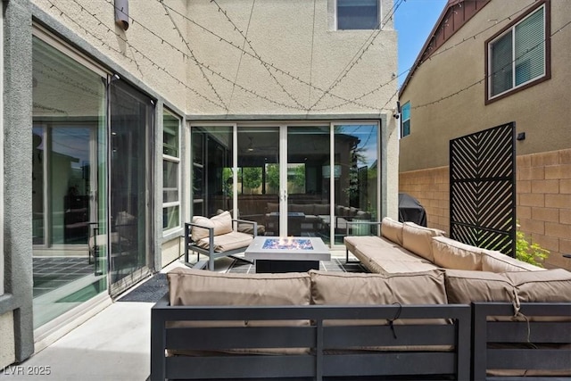 9710 Hiking Ave, Las Vegas, NV 89166 - view of patio with an outdoor living space with a fire pit