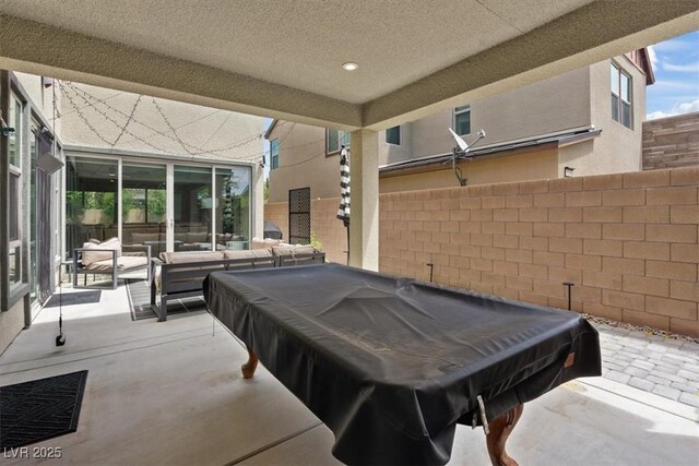 9710 Hiking Ave, Las Vegas, NV 89166 - view of patio with an outdoor living space