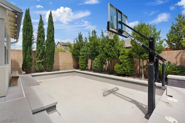 9710 Hiking Ave, Las Vegas, NV 89166 - fenced backyard featuring basketball hoop