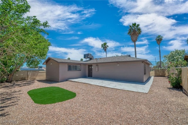 rear view of house featuring a patio area and a fenced backyard