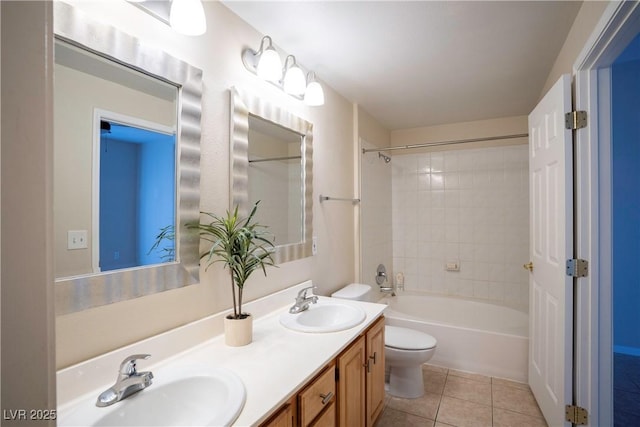 8555 W Russell Rd Unit 2020, Las Vegas, NV 89113 - bathroom with toilet, tile patterned flooring, double vanity, and shower / washtub combination