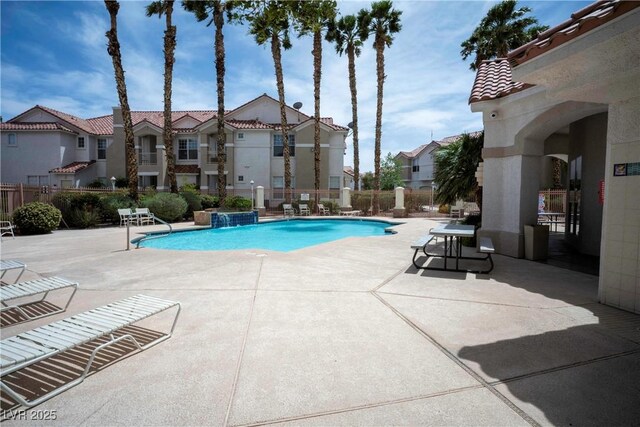 8555 W Russell Rd Unit 2020, Las Vegas, NV 89113 - community pool featuring fence, a patio area, and a residential view
