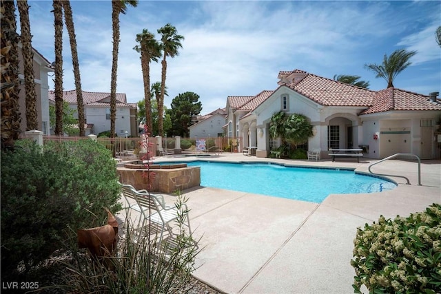 8555 W Russell Rd Unit 2020, Las Vegas, NV 89113 - community pool featuring a patio and fence