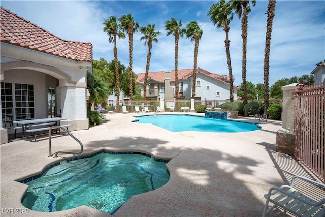 8555 W Russell Rd Unit 2020, Las Vegas, NV 89113 - community pool featuring a patio area and fence