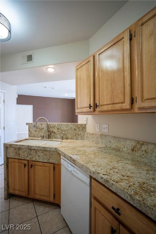 8555 W Russell Rd Unit 2020, Las Vegas, NV 89113 - kitchen featuring white dishwasher, a sink, light tile patterned floors, a peninsula, and light stone counters