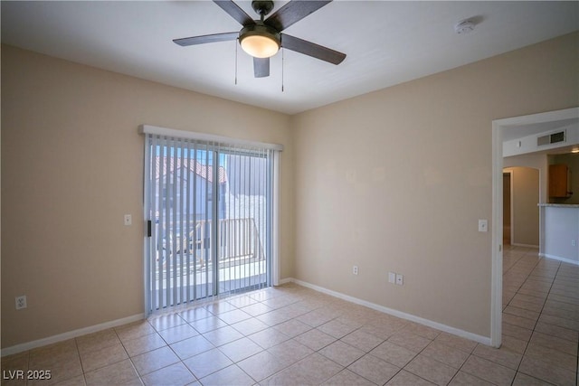 8555 W Russell Rd Unit 2020, Las Vegas, NV 89113 - spare room with arched walkways, a ceiling fan, light tile patterned flooring, and a smoke detector
