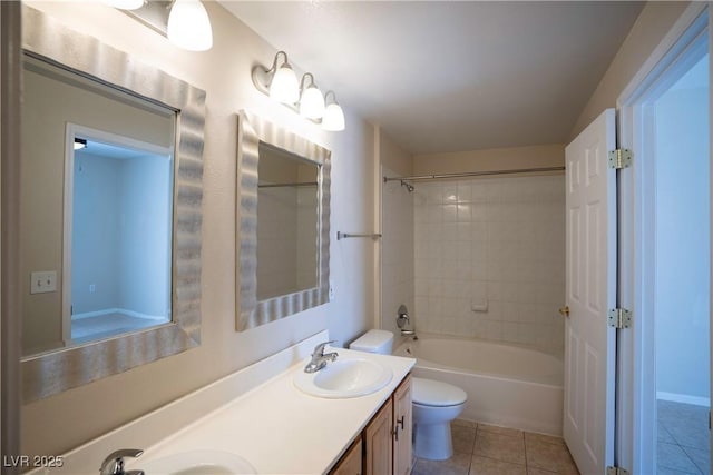 8555 W Russell Rd Unit 2020, Las Vegas, NV 89113 - bathroom featuring toilet, tile patterned floors, double vanity, and bathtub / shower combination