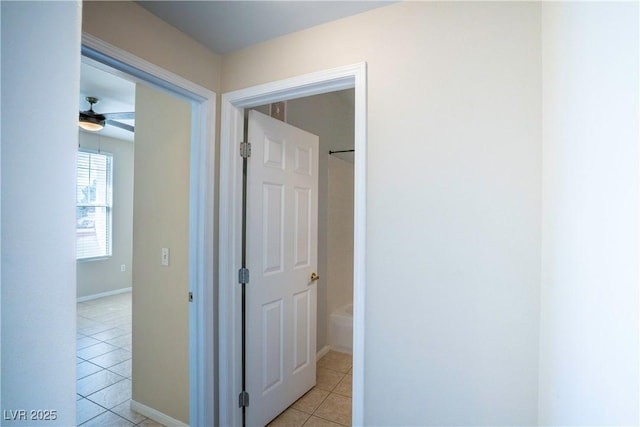 8555 W Russell Rd Unit 2020, Las Vegas, NV 89113 - hallway featuring light tile patterned floors and baseboards